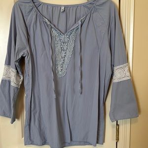 Light blue 3/4 sleeve shirt. Size L